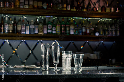 empty cocktail glasses at the bar