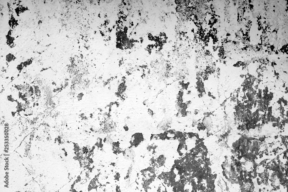 Obraz premium Сraked weathered cement wall texture in black and white.
