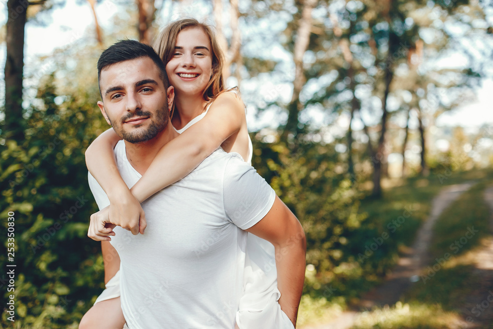 Fototapeta premium Beautiful couple spend time in a summer park