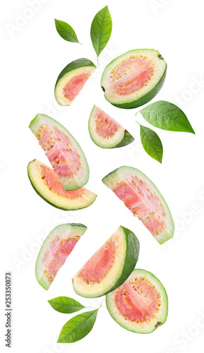 Falling guava fruits on white background photo