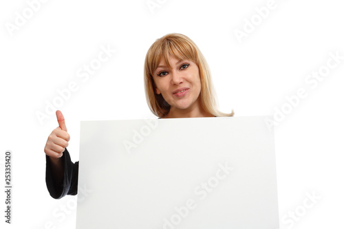 Beautiful girl with a blank poster on a white background. The girl is holding a banner for text sale. Happy girl invites. Model blonde on a white background. Girl approves