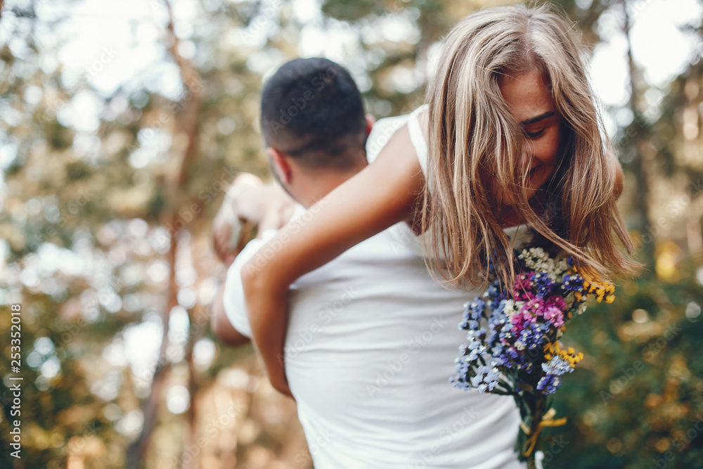 Fototapeta premium Beautiful couple spend time in a summer park