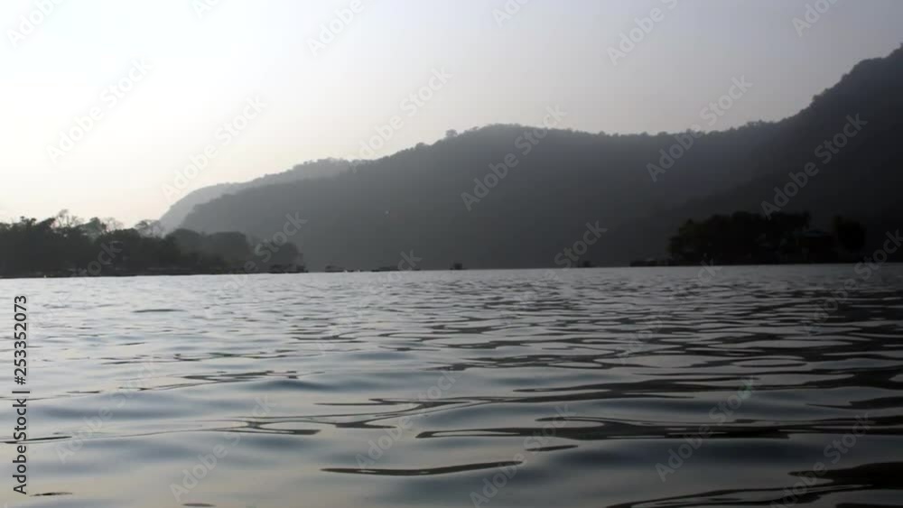 The beauty of an early morning on a lake with the early morning haze. The beauty of an early morning on a lake with the early morning haze.