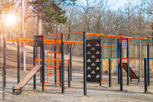 Street sports ground gym at the forest with green pines open air