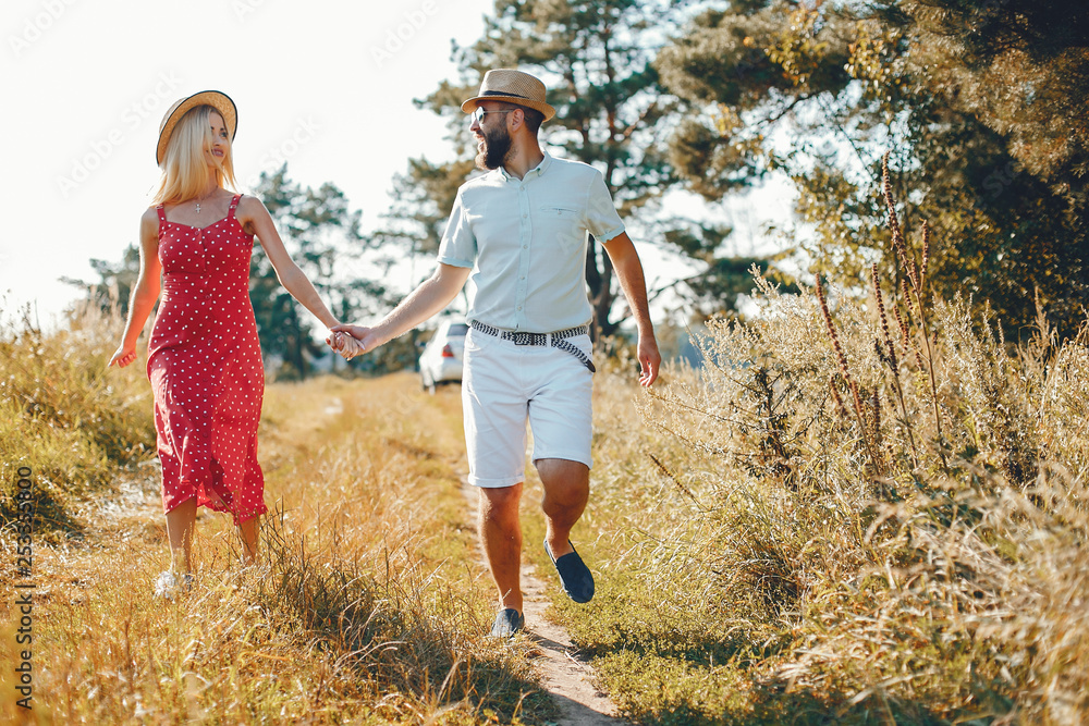 Fototapeta premium Beautiful couple spend time in a summer park