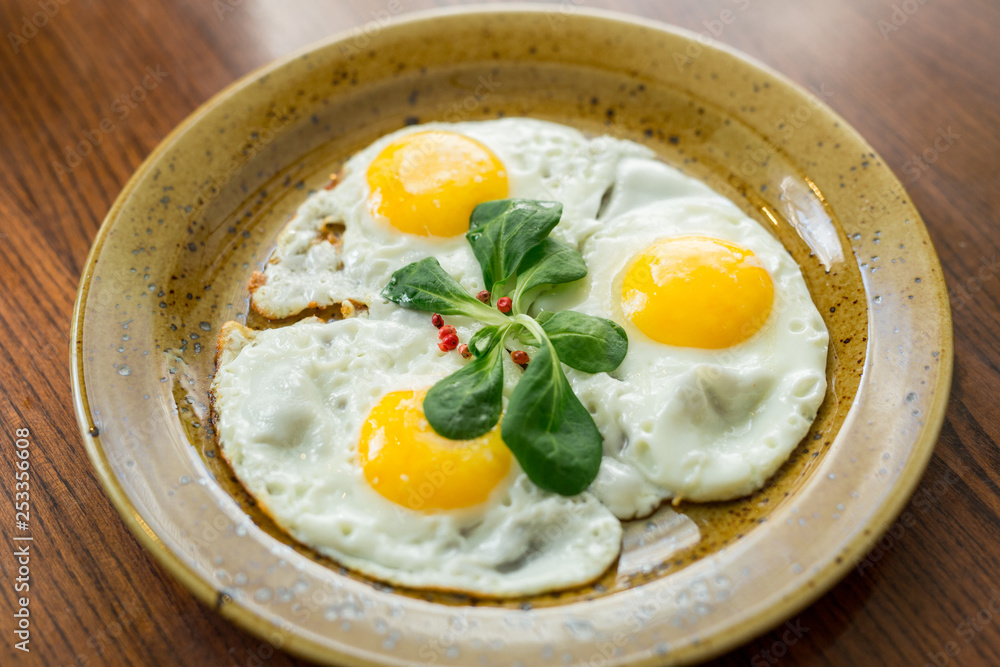 fried eggs-three eggs with herbs