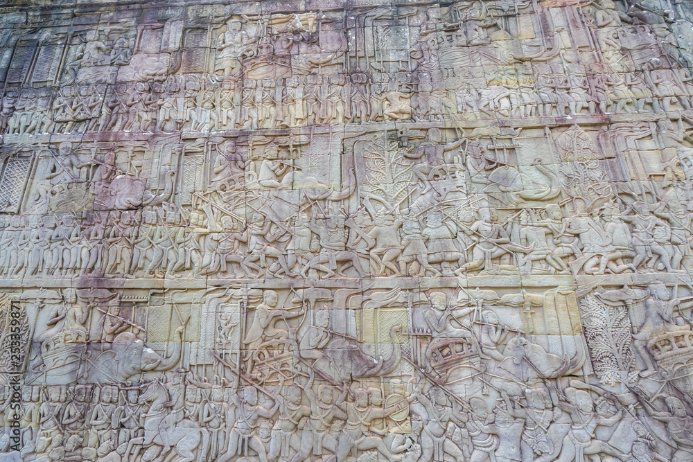 Relief on the wall of gallery of Bayon temple in Angkor Thom. Cambodia Relief on the wall of gallery of Bayon temple in Angkor Thom. Cambodia