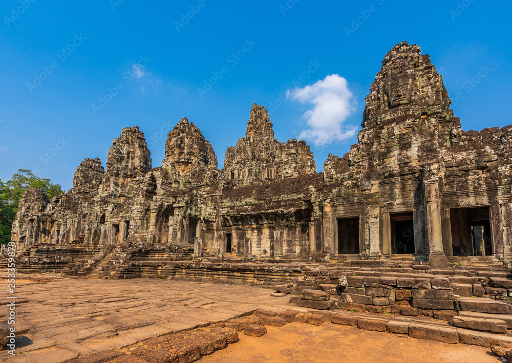 Bayon temple in Angkor Thom, Cambodia: first enclosure wall, galleries and face towers. West facade Bayon temple in Angkor Thom, Cambodia: first enclosure wall, galleries and face towers. West facade