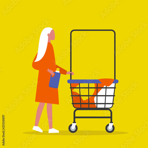 Colourful clothes in a trolley. Self service. Young female character rolling a laundry cart. Laundromat. Detergent. Daily chores concept.