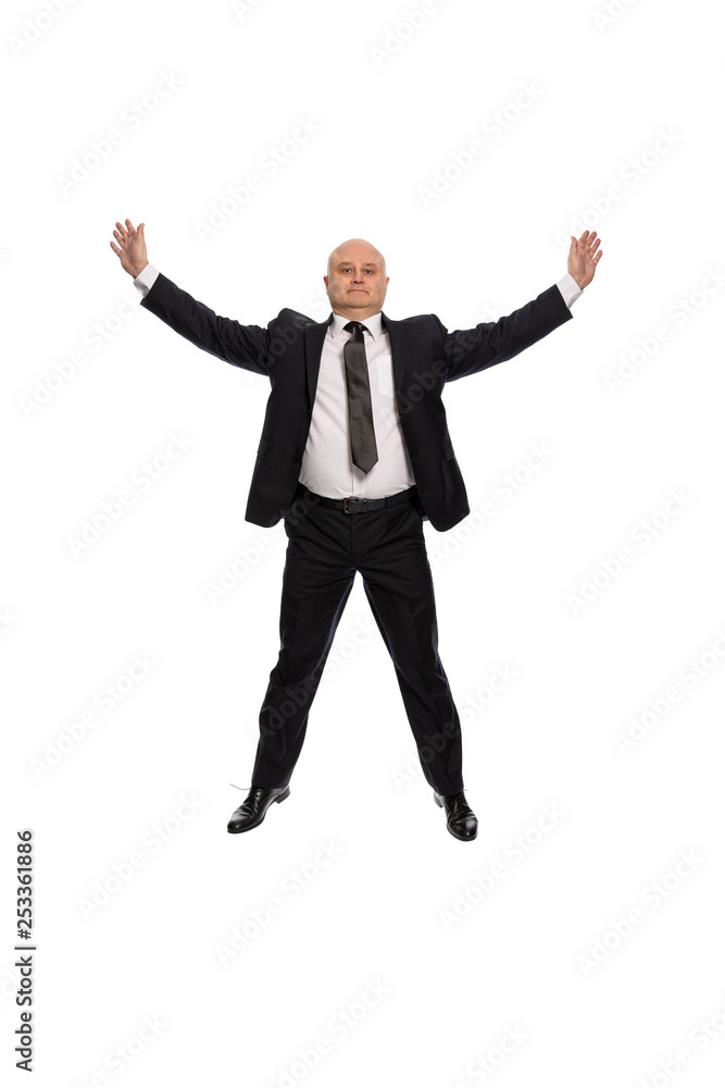 Bald middle-aged man in a suit jumping, businessman, isolated on white background Bald middle-aged man in a suit jumping, businessman, isolated on white background