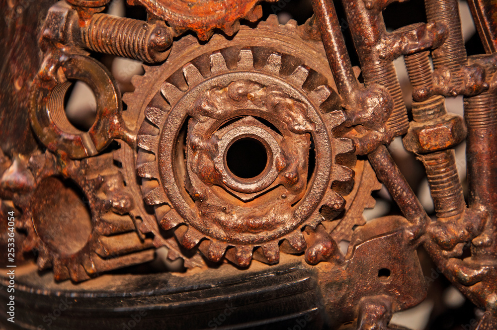 Old, worn, rough mechanical gears made of rusty metal. Design minimalism. Iron composition. Retro style. Stylish top and trendy design background round gears.