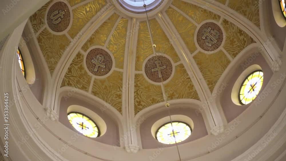 View looking up at the ornate domed roof of a church interior View looking up at the ornate domed roof of a church interior