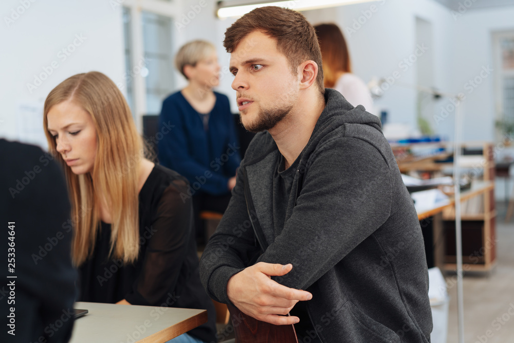Fototapeta premium Young man in a business meeting listening intently