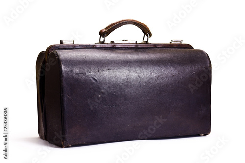 Brown leather old luggage bag isolated on white. Brown vintage valise isolated on a white background. Part of set.