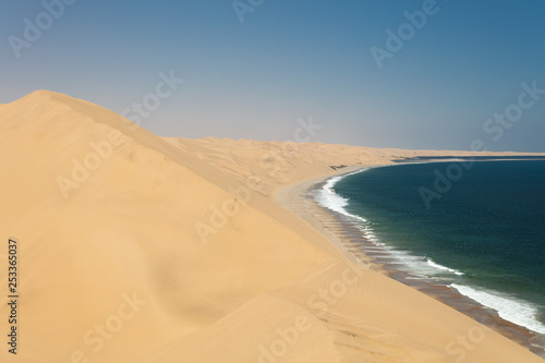 Fototapeta Naklejka Na Ścianę i Meble -  Sandwich Harbour and the stunning dunes in Namibia during the Summer.