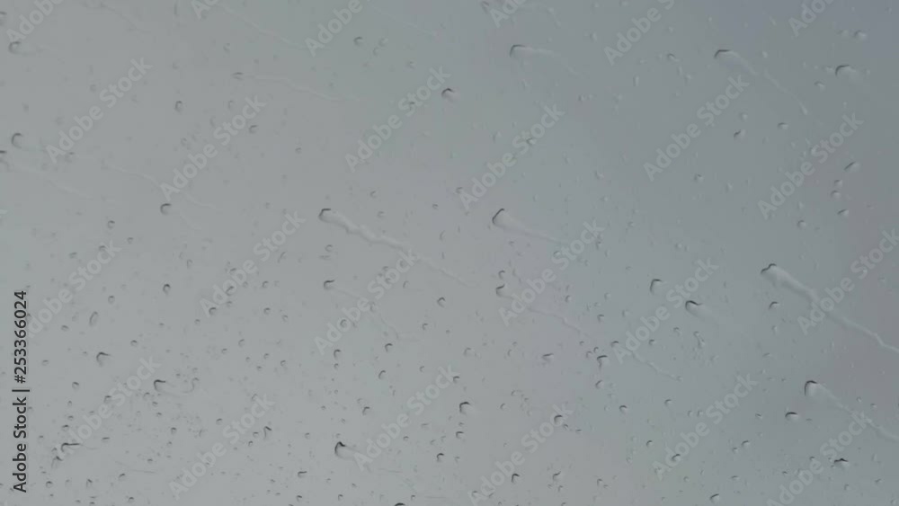 Raindrops on the windshield of a moving car. Raindrops on the windshield of a moving car.