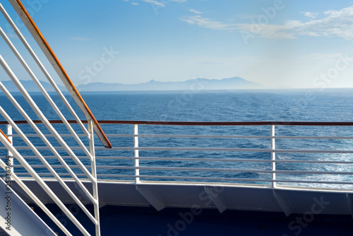 Distant coast view from a cruise ship deck © Yury Kirillov