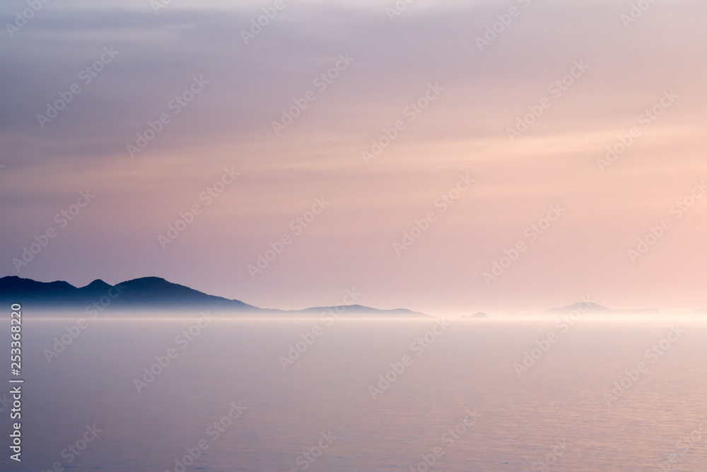 Sunlit fog on a coastline