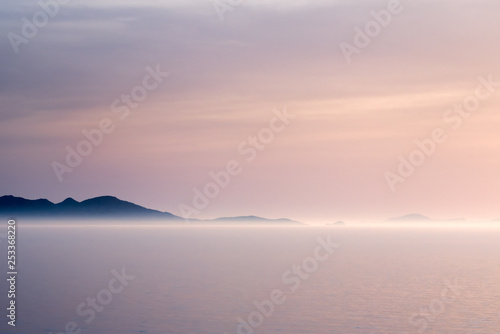 Sunlit fog on a coastline © Yury Kirillov