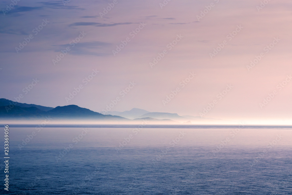 Sunlit fog on a coastline Sunlit fog on a coastline
