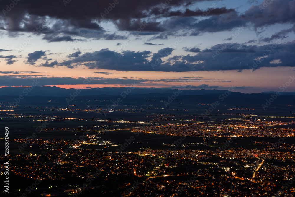 Fototapeta premium View to the Sofia city at dusk. View from the Kopitoto Hill, Vitosha Mountain, Bulgaria