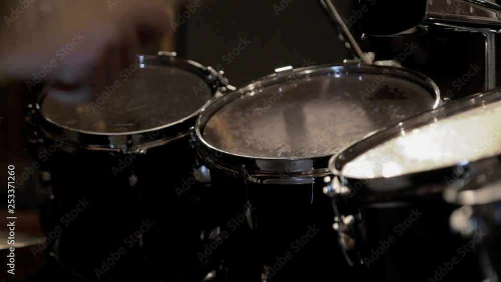 A drummer playing fills quickly. A drummer playing fills quickly.