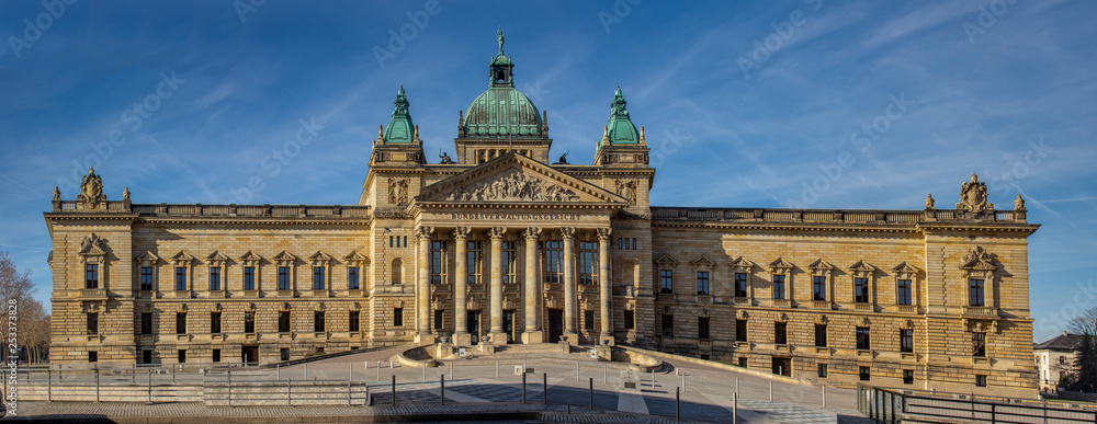 Panorama of the Federal Administrative Court Leipzig - Germany at blue sky.At the courthouse is the text Federal Administrative Court in German