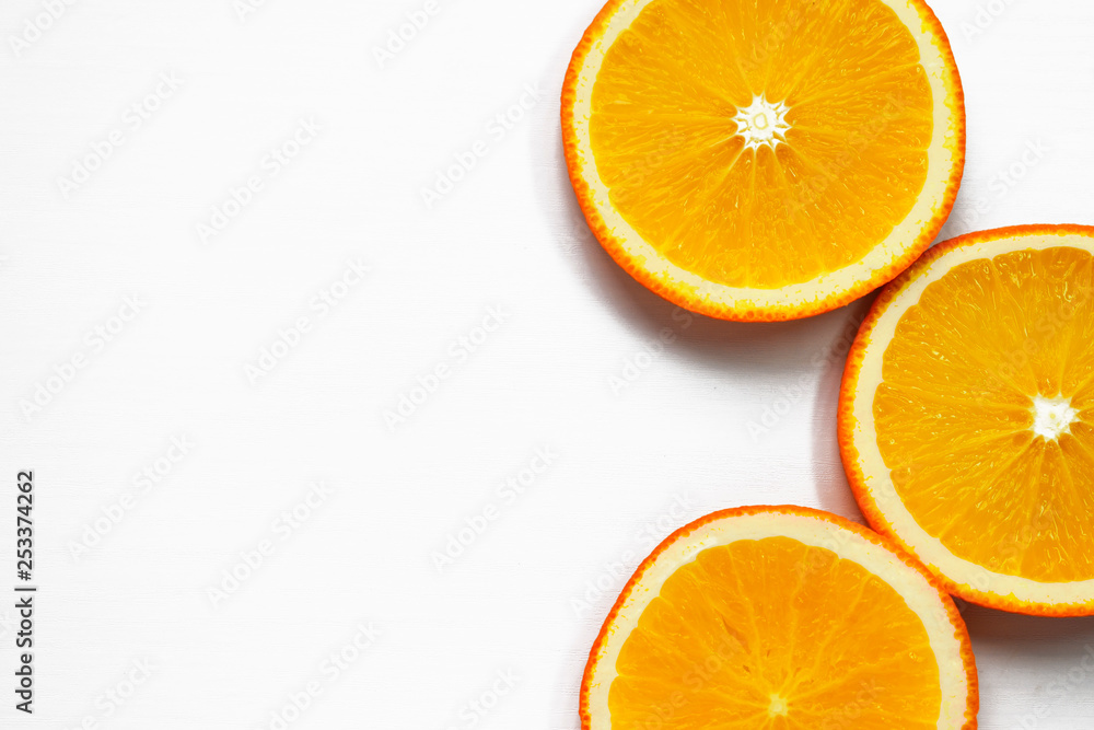 Orange slices on white background. Tropical bright juicy fruit vegetarian healthy diet flat lay banner Orange slices on white background. Tropical bright juicy fruit vegetarian healthy diet flat lay banner