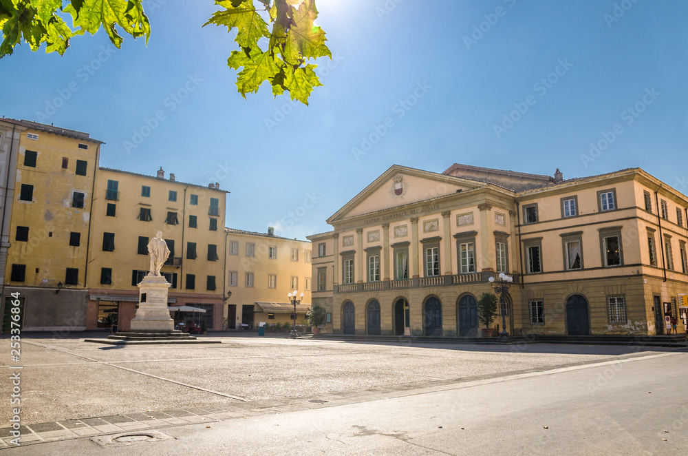 Teatro del Giglio theatre building and monument on Piazza del Giglio square in historical centre of medieval town Lucca in beautiful summer day with blue sky background, Tuscany, Italy
