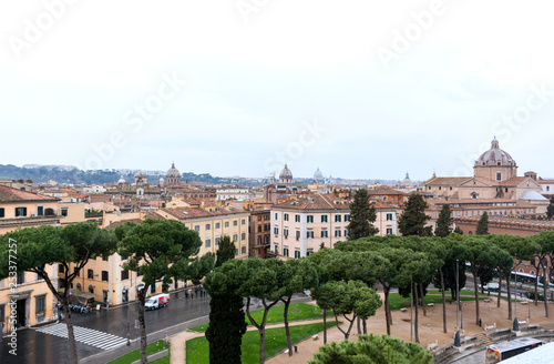 view of Rome on a cloudy day, buildings in Rome, pine trees, Rome street,