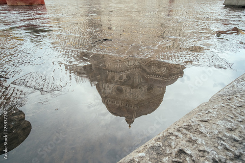 Reflected view of one of the most famous tourist attraction in Florence, the main dome of central cathedral Duomo, Santa Maria del Fiore at a roainy day