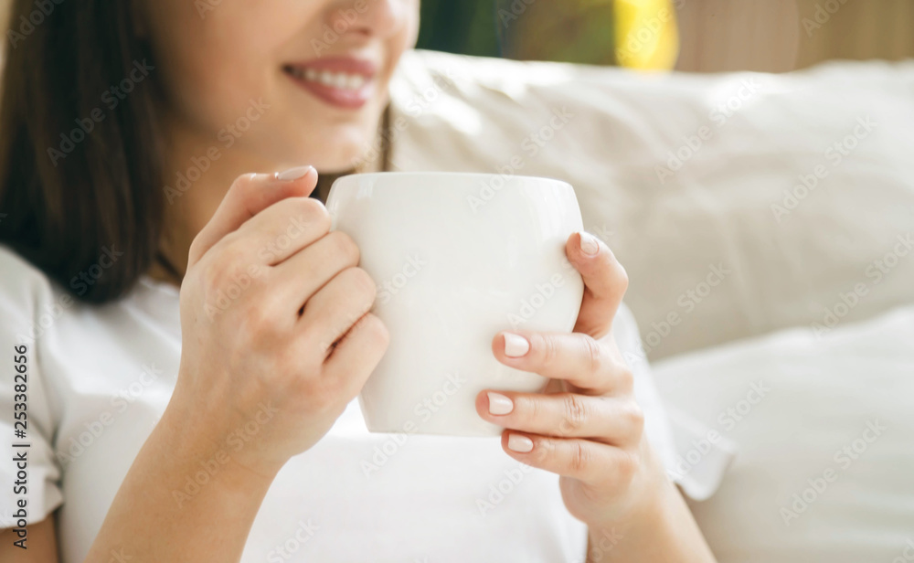 Portrait view of brunette woman sitting in the bed and using virtual screen Portrait view of brunette woman sitting in the bed and using virtual screen