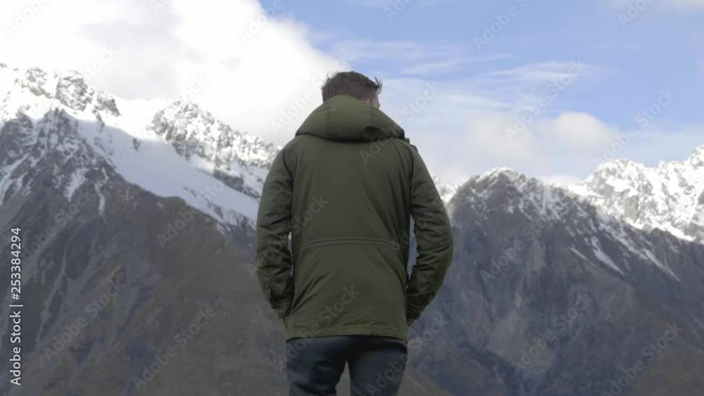 Man standing on a mountain Man standing on a mountain
