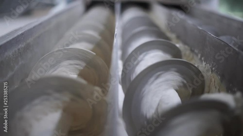 Close-up of the inside of a factory machine at a flour milling plant