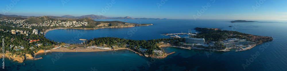 Aerial drone photo of iconic turquoise sandy celebrity beach of Asteras or Astir and ancient temple of Apollo Zoster, Vouliagmeni, Athens riviera, Attica, Greece
