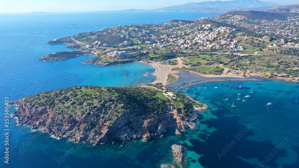 Aerial drone photo of famous small islet with picturesque chapel of Agios Nikolaos and small marina, Anavissos area, Attica, Greece