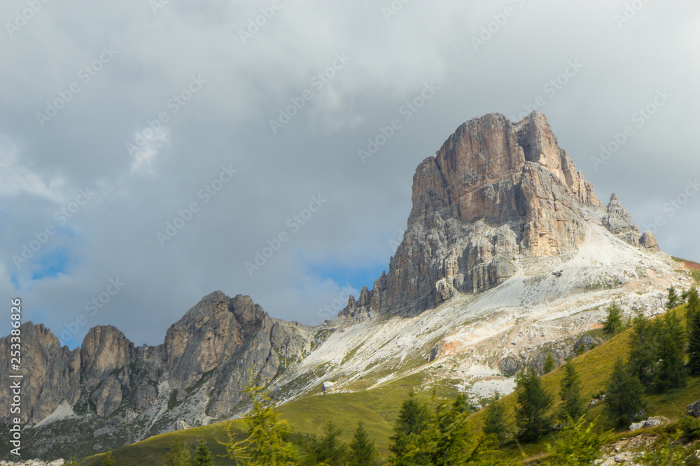 view of Dolomites mountains on a foggy day, South Tyrol