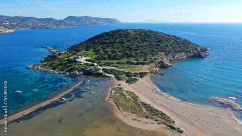 Aerial drone photo of famous small islet with picturesque chapel of Agios Nikolaos and small marina, Anavissos area, Attica, Greece