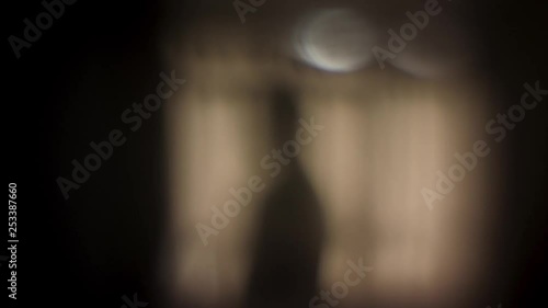 Ghostly ghoulish figure entering frame and pointing around like a skeleton hand alien looking apparition