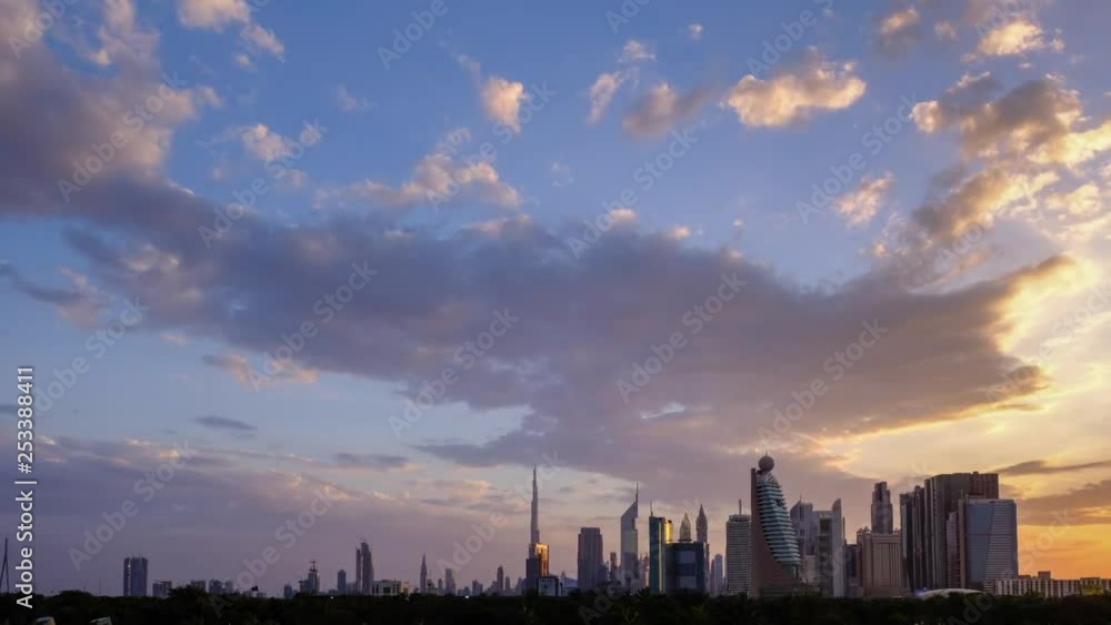 Dubai Skyline time-lapse at sunset with epic clouds and colors.