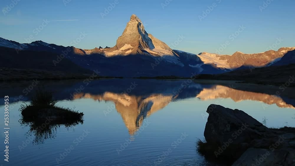 The Stellisee and the famous Matterhorn during a summers sunrise. Zermatt, Switzerland. The Stellisee and the famous Matterhorn during a summers sunrise. Zermatt, Switzerland.