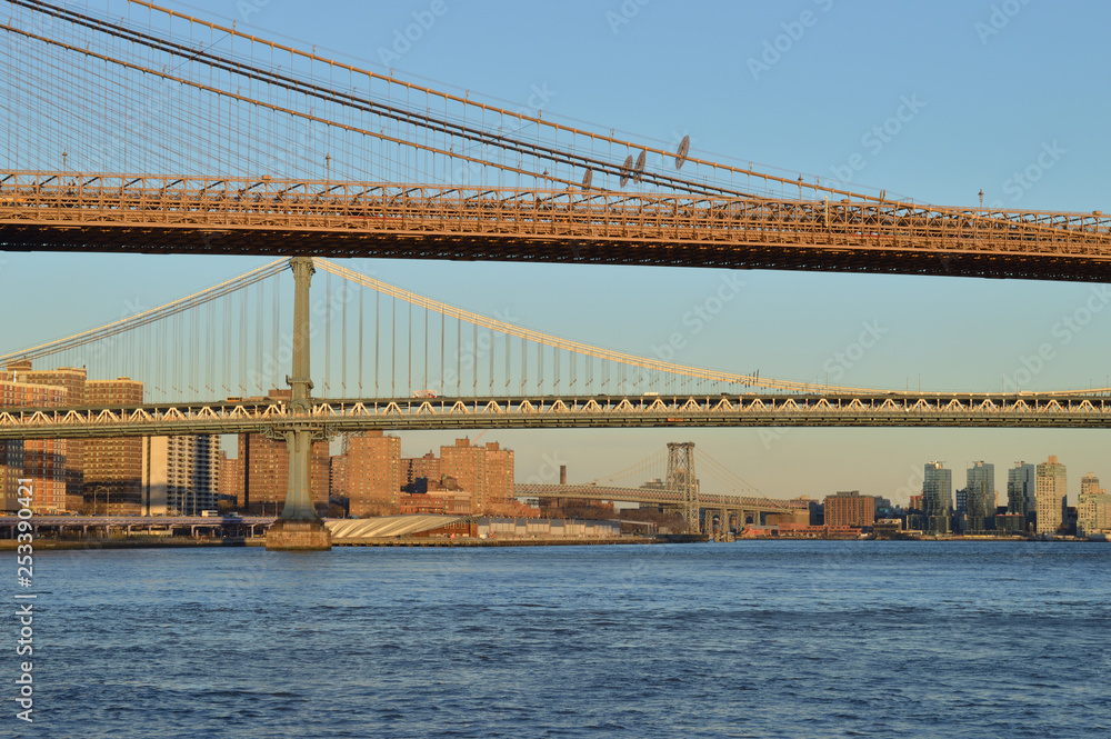 New York City bridges at sunset. New York City bridges at sunset.