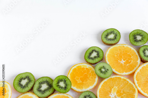 Background for the profile  design  printing with fruit. The basis for the banner with orange and kiwi. Fresh and natkralnye vitamins. Healthy food. Flat lay  top view.