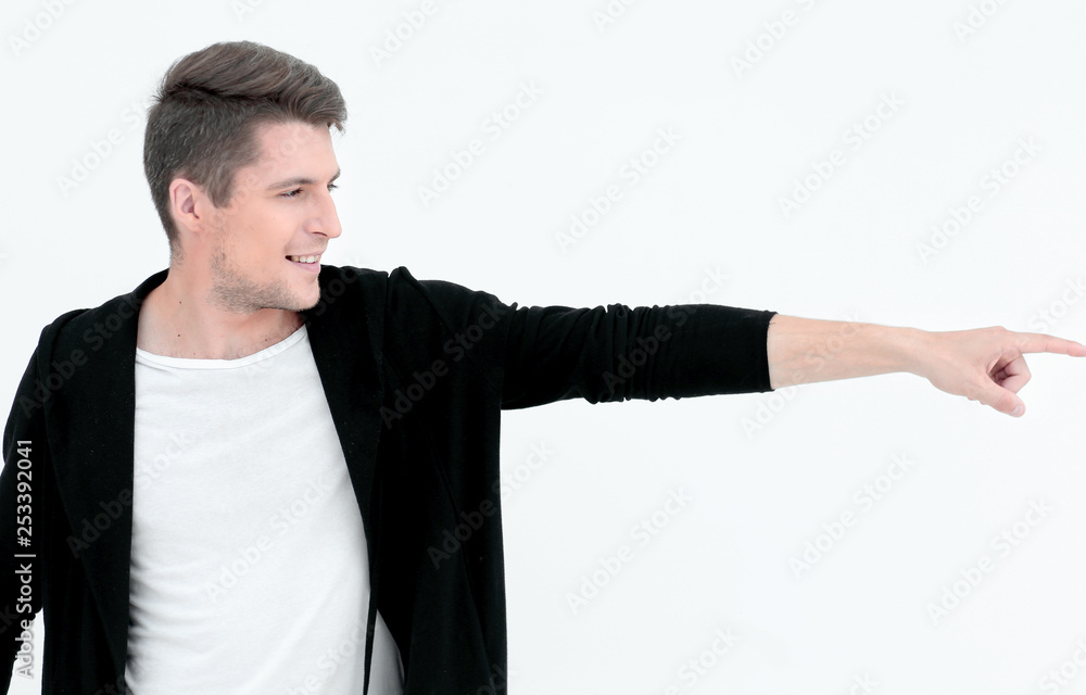 handsome guy pointing to the side at copy space handsome guy pointing to the side at copy space