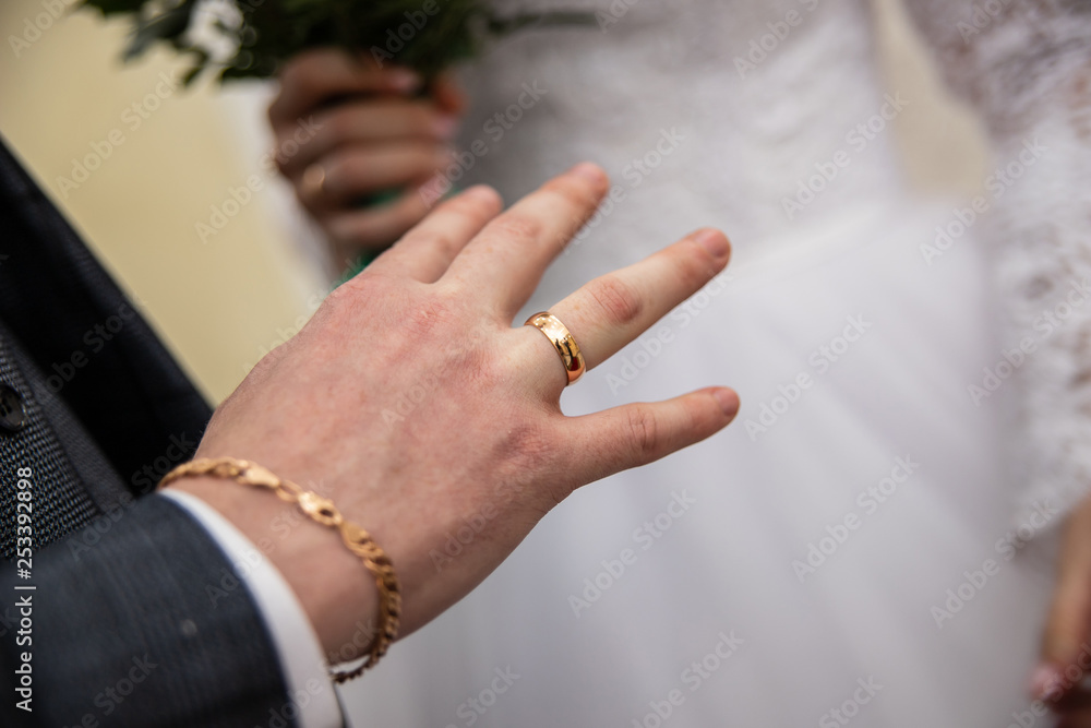 ring on the groom's finger