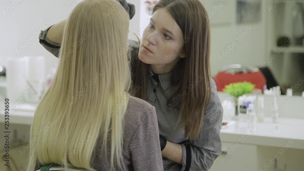Makeup artist makes eyebrow staining with natural dyes, toning with henna, cosmetic procedures in the beauty salon. Makeup artist makes eyebrow staining with natural dyes, toning with henna, cosmetic procedures in the beauty salon.