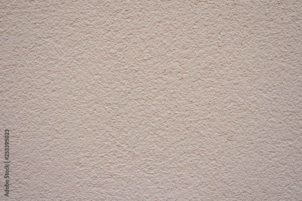 Feine Wand mit Creme-Farbe gestrichen und kontrastarm Feine Wand mit Creme-Farbe gestrichen und kontrastarm