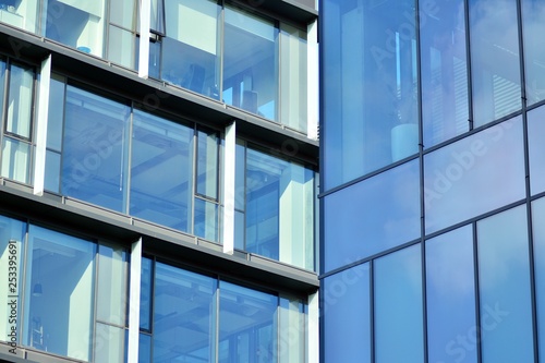 Sky reflected in a modern building glass facade