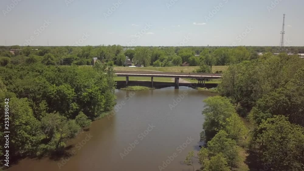 aerial over water looking ahead to four lane bridge aerial over water looking ahead to four lane bridge