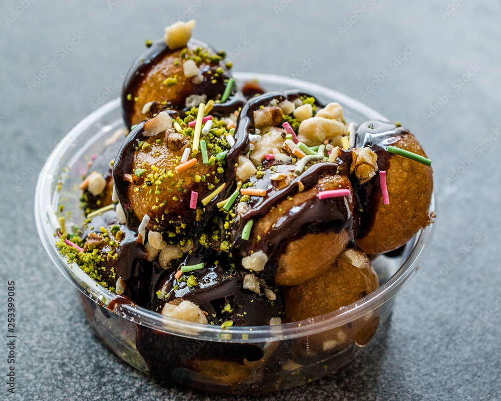 Turkish Dessert Lokma with Chocolate Sauce / Round Fried Dough Balls Petulla.